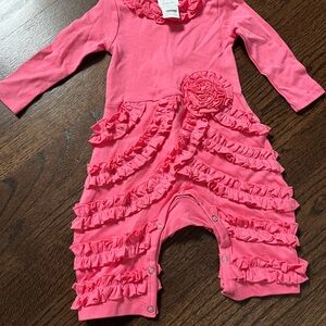 Bright pink one piece baby ruffle romper